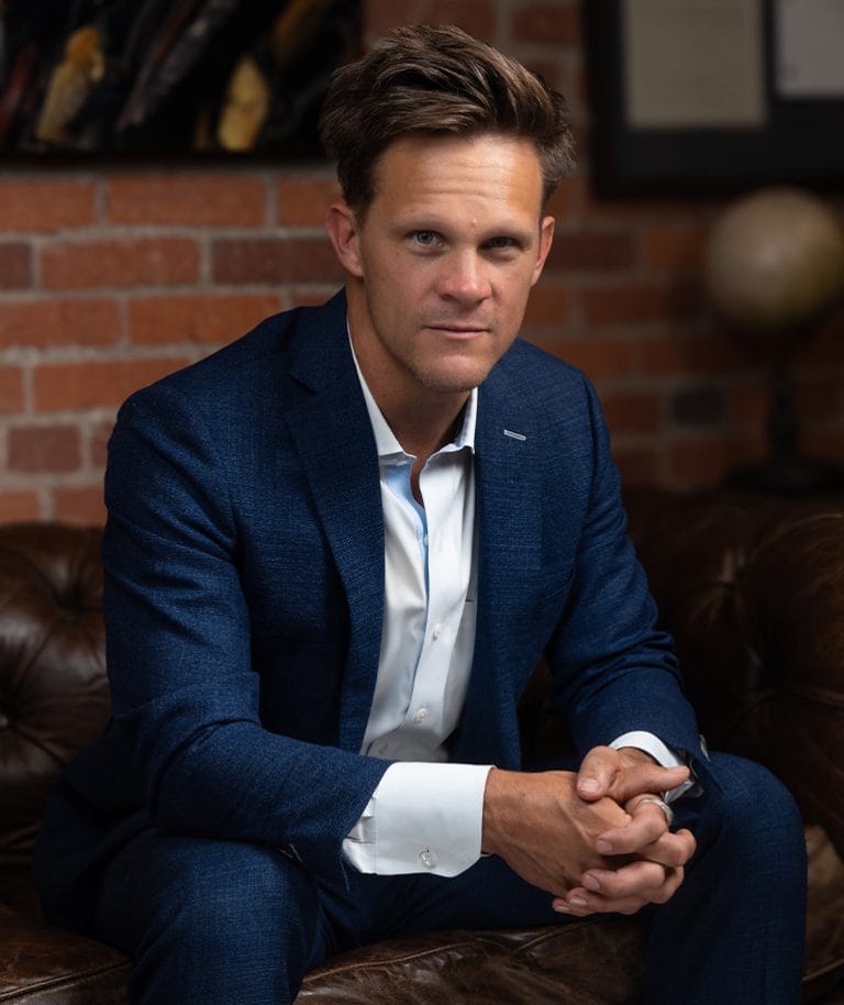 Kurt Zaner, founding partner of Zaner Law, seated at the firm's Denver office