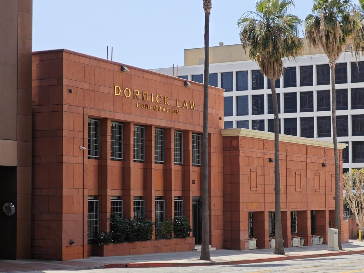 A Dordick Law Corporation office building in Los Angeles, the firm's name in gold lettering above the entrance